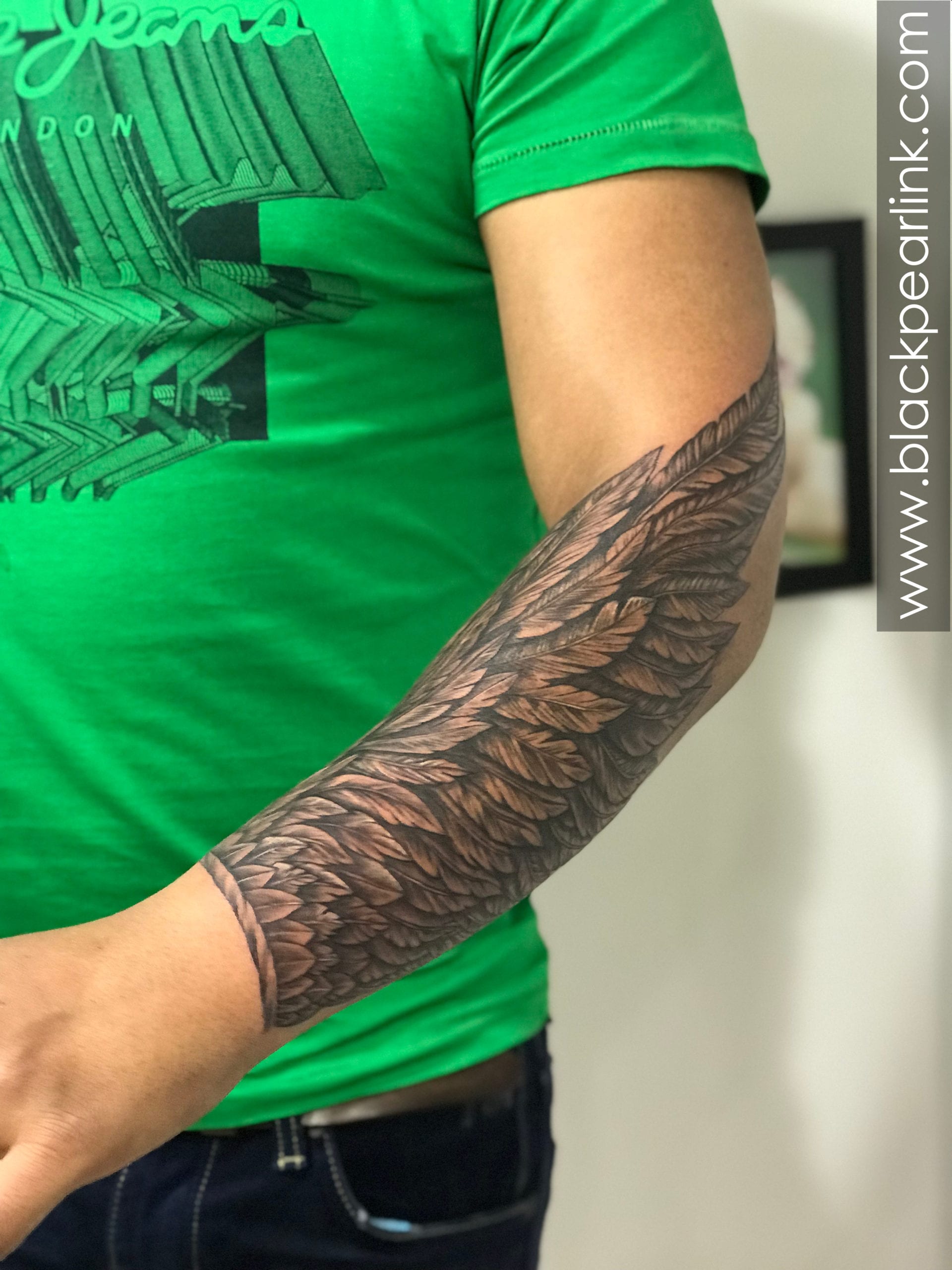 wing tattoo forearm