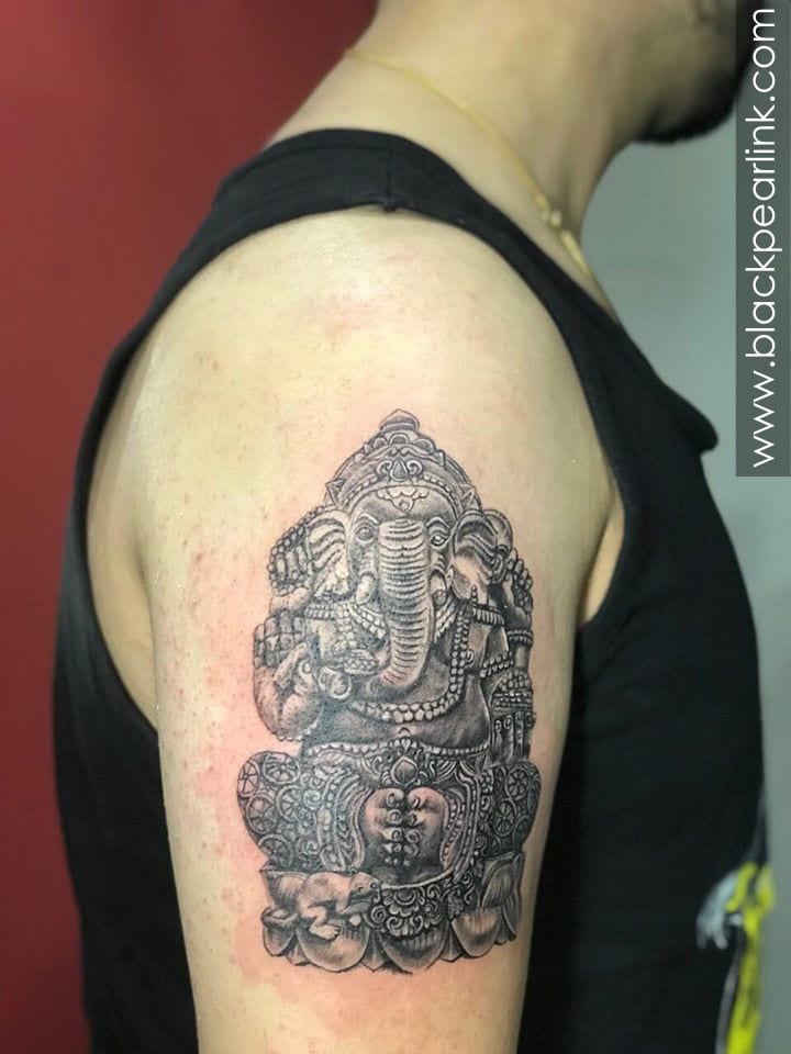 Ganesha Sculpture Tattoo on Biceps