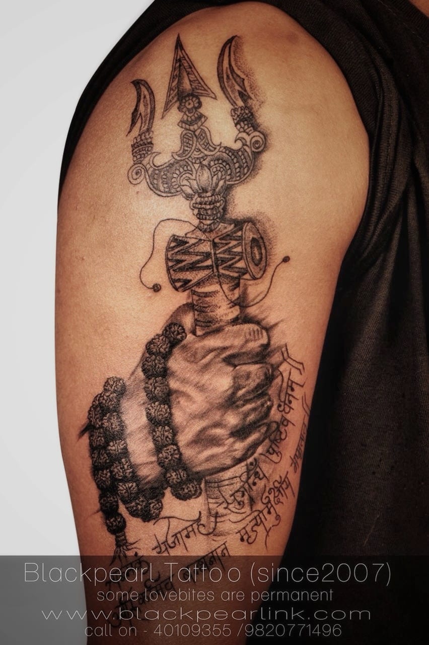 Tattoo of Lord Shiva hand holding Trishul