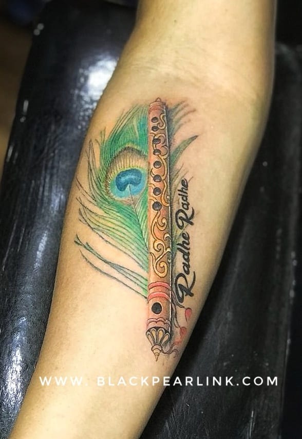 Peacock Feather and Flute Tattoo