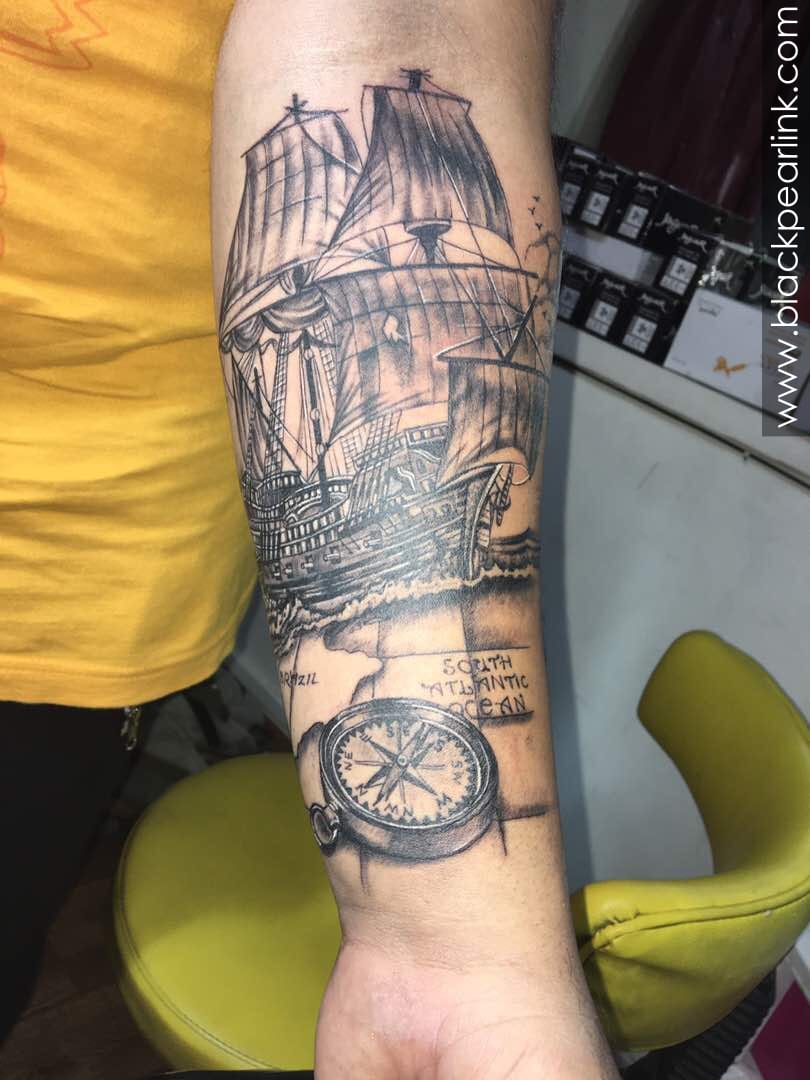 tattoo drawing of a compass made by needles on paper | Midjourney